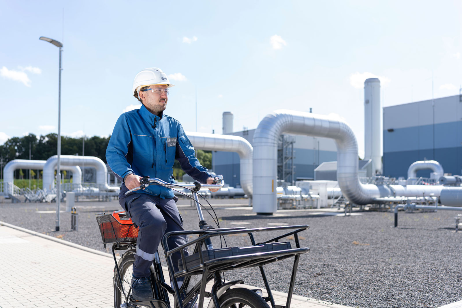 Our colleague Ahmet on his cargo bike at the Legden compressor station